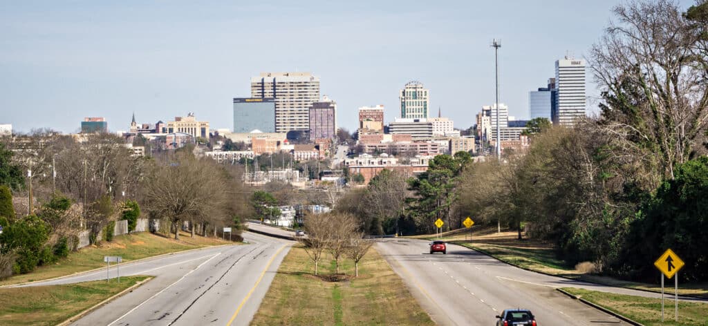 Views of a highway with the skyline of Columbia SC in the background as seen from hotels near Columbia SC airport.