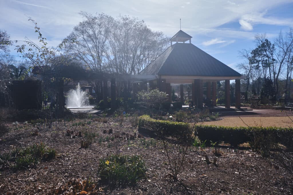 Photo of the Riverbanks Botanical Gardens showing few flowers in winter but a fountain.