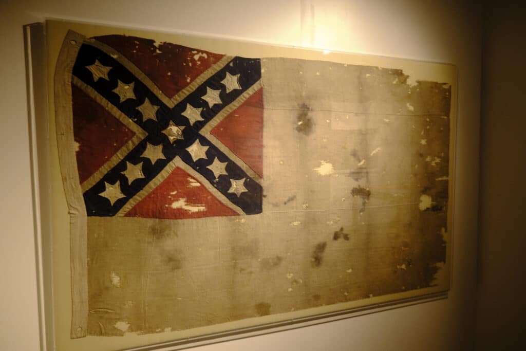 Historic second confederate national flag with the confederate battle flat in the corner of a white field on display at the South Carolina Confederate Museum in Columbia, SC.