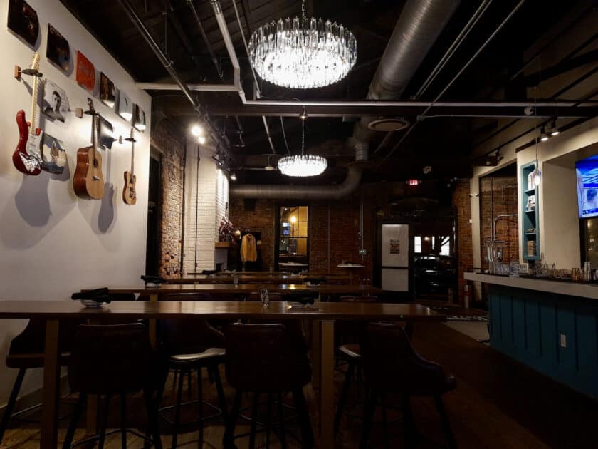 Photo of interior of the Vista Steel Hands in Columbia, SC with guitars on the wall.
